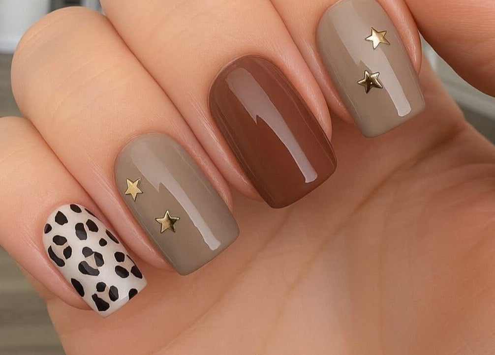 Stylish nail art with star and leopard design at Mobile Glam, Caerphilly, Wales, GB.
