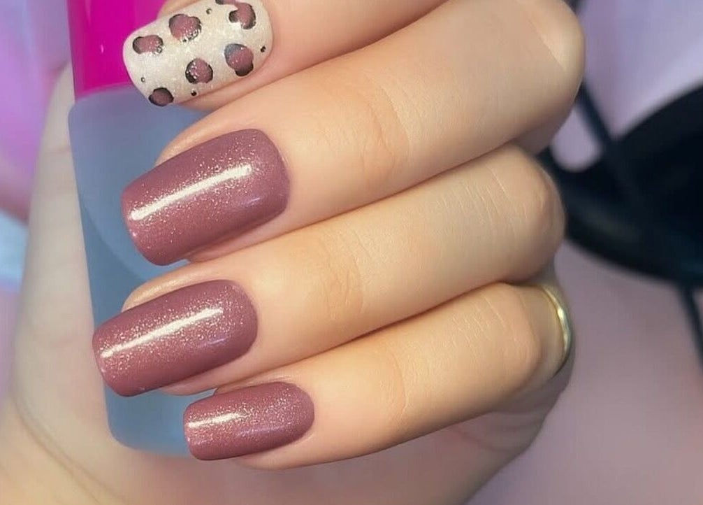 Elegant plum and leopard nail design at Mobile Glam, Caerphilly, Wales, GB.