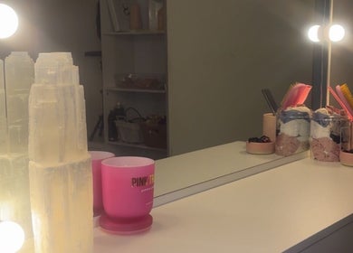 Glamorous vanity setup at Brush’d Collective, Horsham, Victoria, AU, with glowing lights and chic decor.