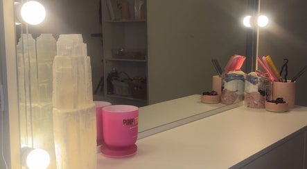 Glamorous vanity setup at Brush’d Collective, Horsham, Victoria, AU, with glowing lights and chic decor.