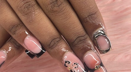 Elegant nail art design at arushisnails, Crawley, England, GB, featuring metallic accents and a glossy finish.