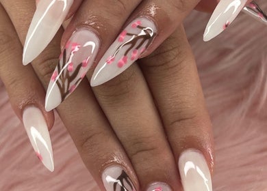 Elegant cherry blossom nail art at arushisnails, Crawley, England, GB, showcasing intricate design.
