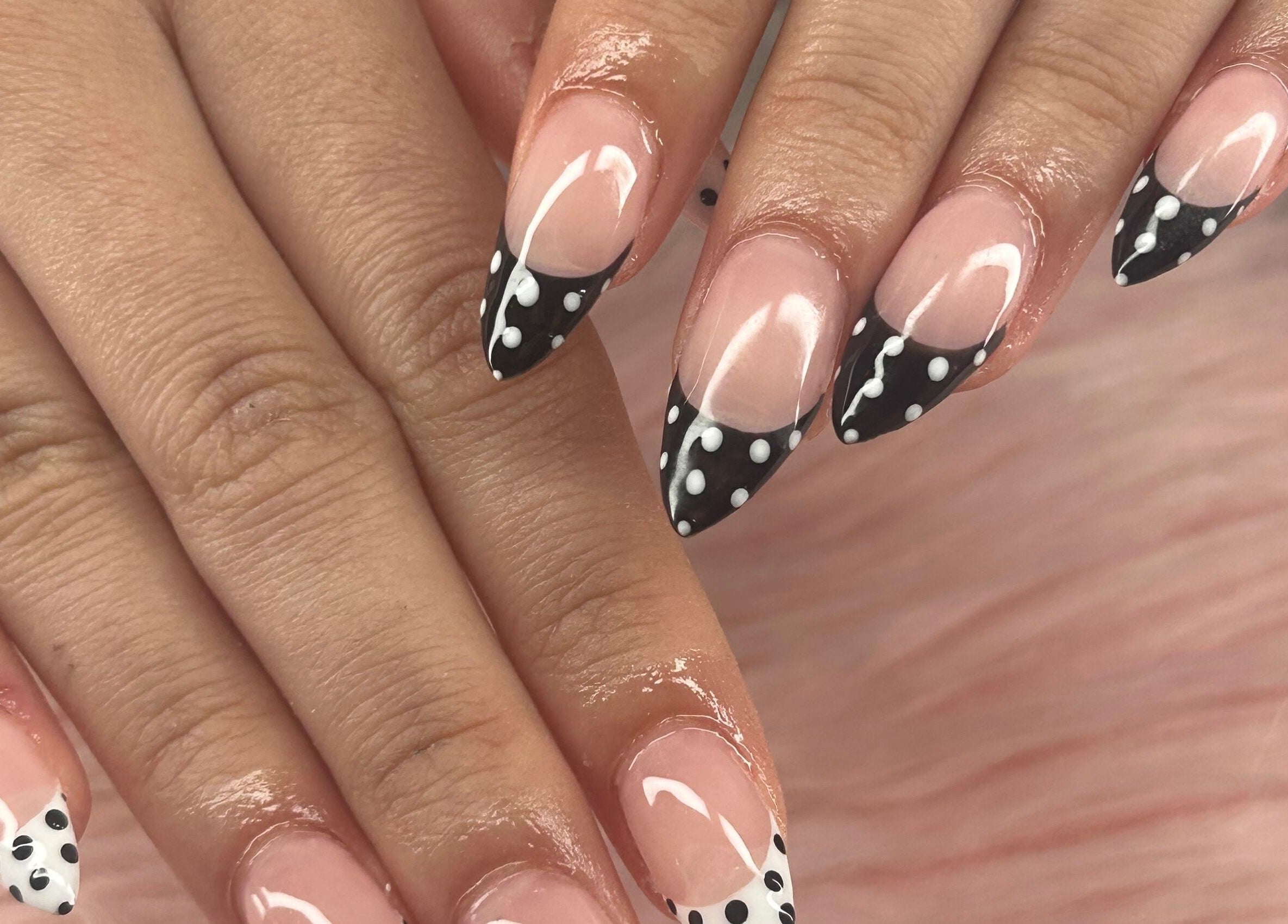 Stylish black and white polka dot nails at arushisnails, Crawley, England, GB. Perfect for a chic look.