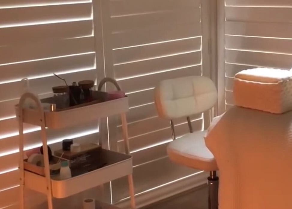 Cozy treatment space at Lollie Lash Lounge, Upper Coomera, Queensland, AU, featuring a comfortable chair and cart.