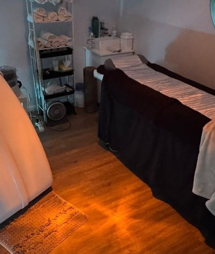 Private treatment room at Skin and Body Boutique in Cape Town, Western Cape, ZA, features a massage table and supplies.