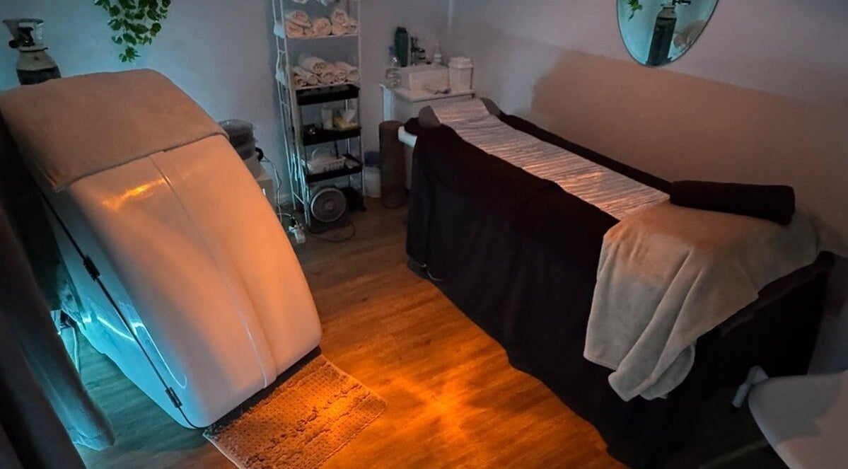 Private treatment room at Skin and Body Boutique in Cape Town, Western Cape, ZA, features a massage table and supplies.