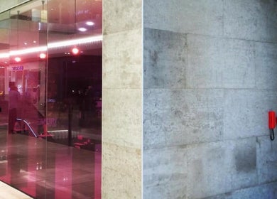 Exterior view of Maison Tsumiki in Melbourne, Victoria, AU, featuring modern glass and concrete design.