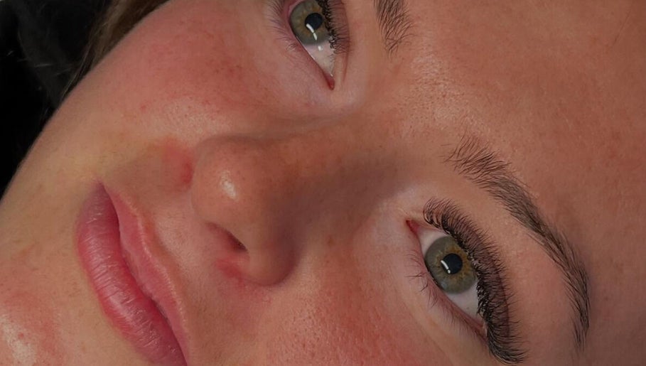 Close-up of a client's radiant face after treatment at Golden Beauty Bar, Peats Ridge, New South Wales, AU.