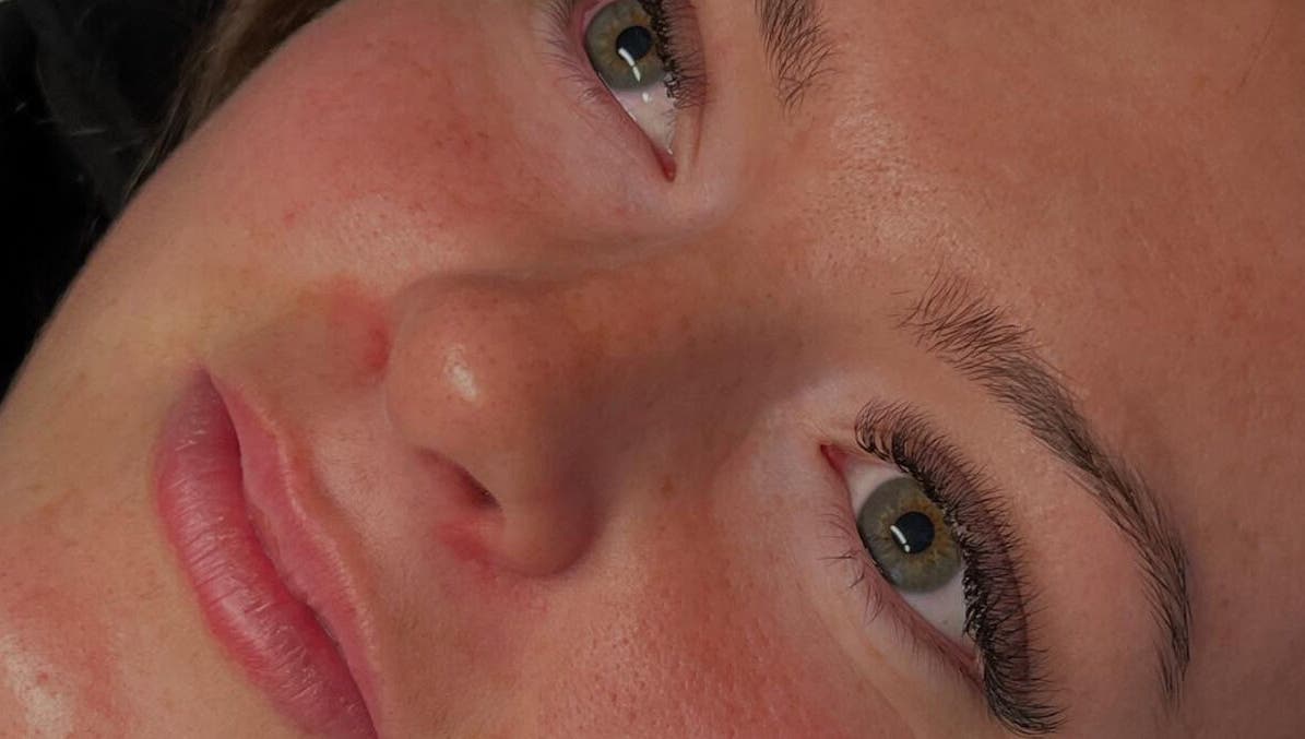 Close-up of a client's radiant face after treatment at Golden Beauty Bar, Peats Ridge, New South Wales, AU.