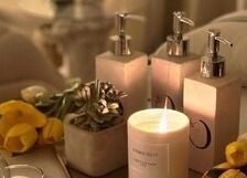 Relaxing spa setup with candles and flowers at Chamomile Spa | كامومايل هوم سبا, Riyadh, Eastern Province, SA.