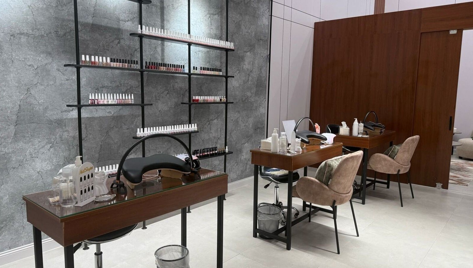 Modern nail care area at Mj Spa in Riyadh, Riyadh Province, SA, featuring plush chairs and manicure stations.