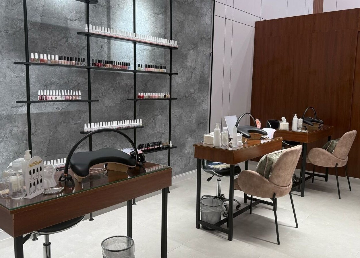 Modern nail care area at Mj Spa in Riyadh, Riyadh Province, SA, featuring plush chairs and manicure stations.