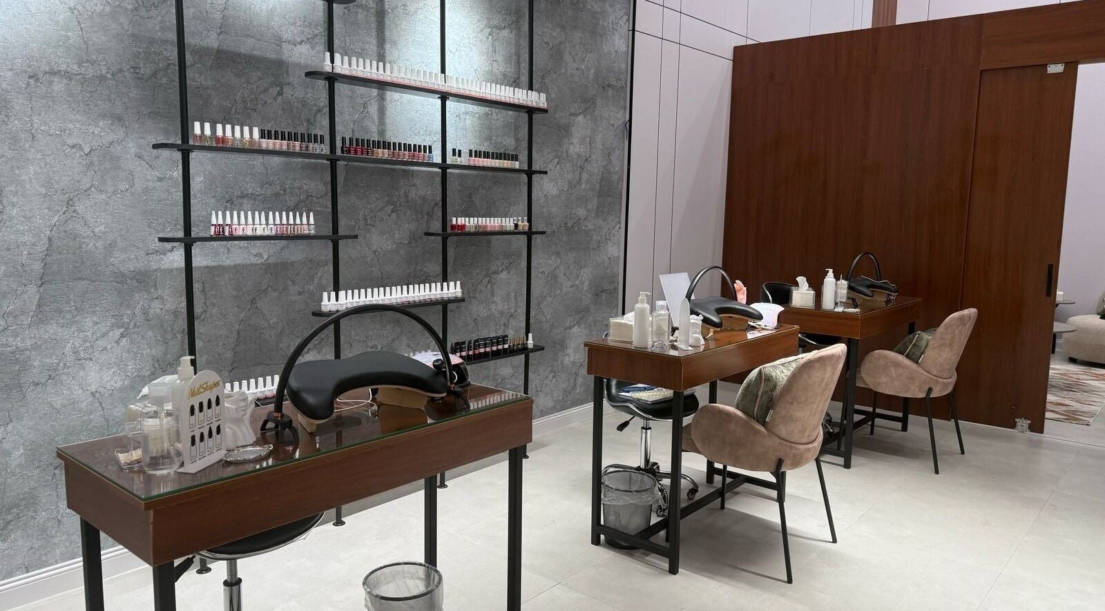 Modern nail care area at Mj Spa in Riyadh, Riyadh Province, SA, featuring plush chairs and manicure stations.