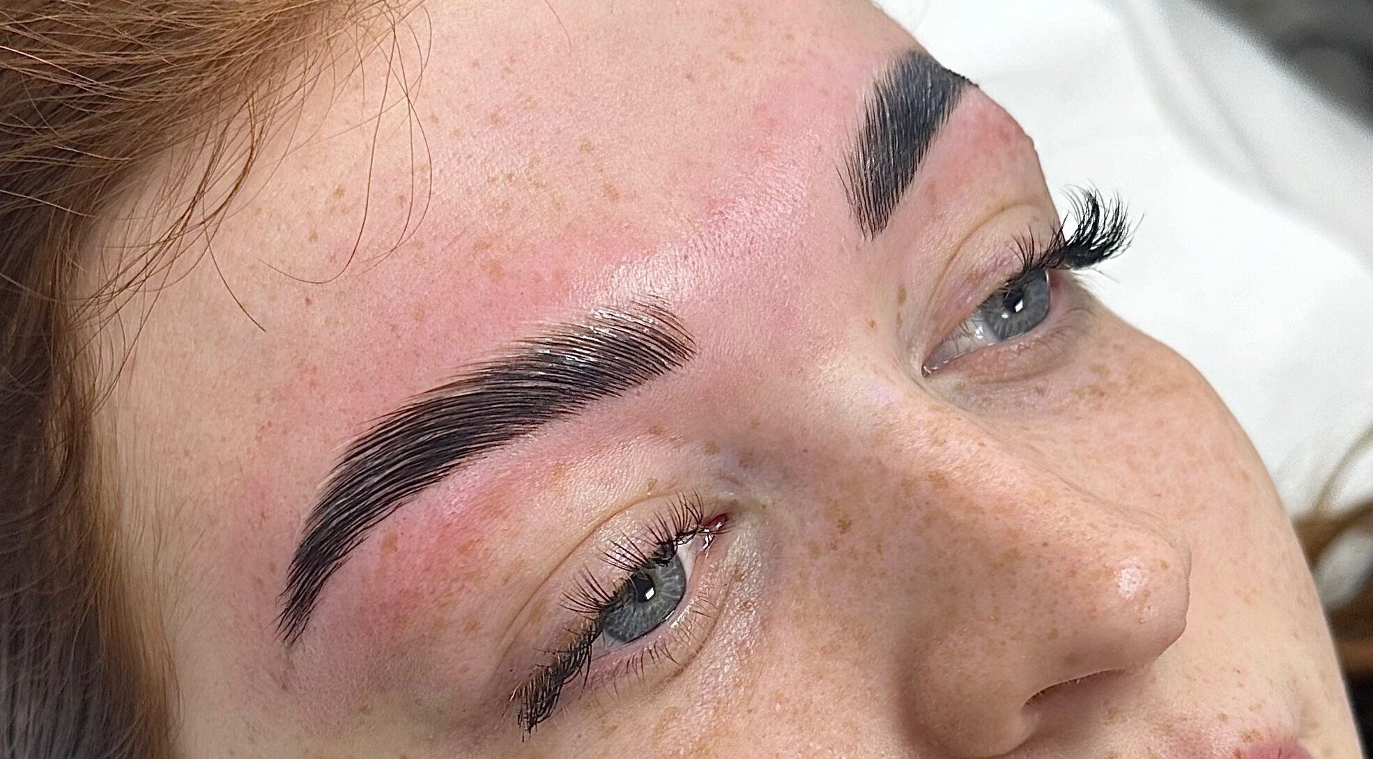 Close-up of perfectly shaped eyebrows at Penelope Ink & Co, Swinton, England, GB.