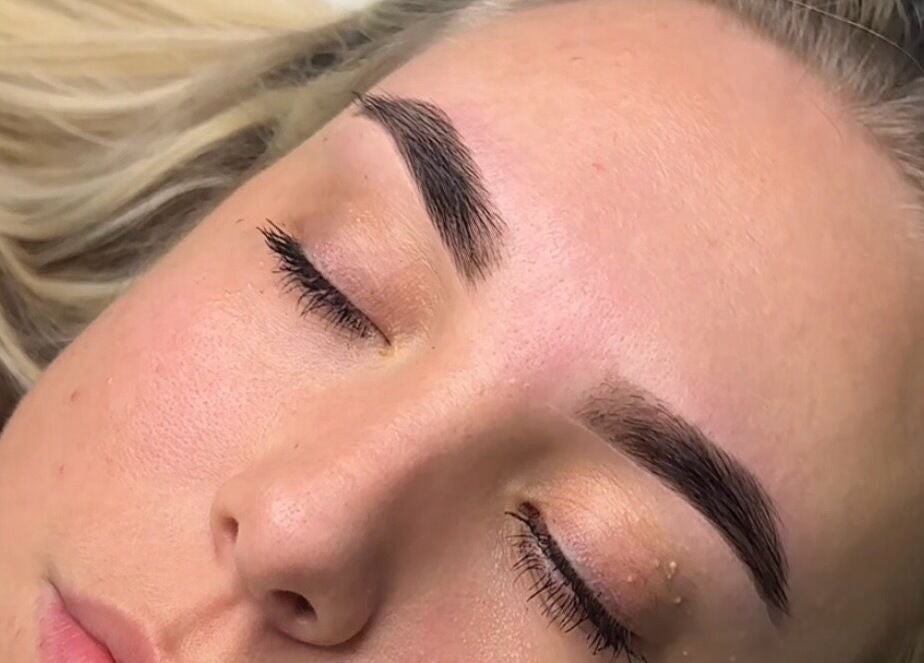Close-up of expertly shaped eyebrows by Penelope Ink & Co, Swinton, England, GB.