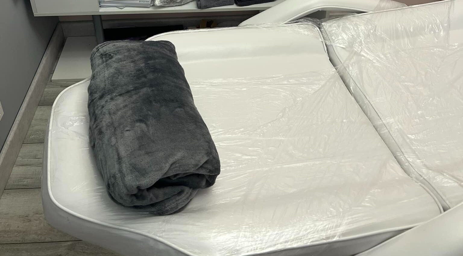 Cozy treatment bed at Lina Holistics & Beauty in Stoke-on-Trent, England, ideal for relaxation.