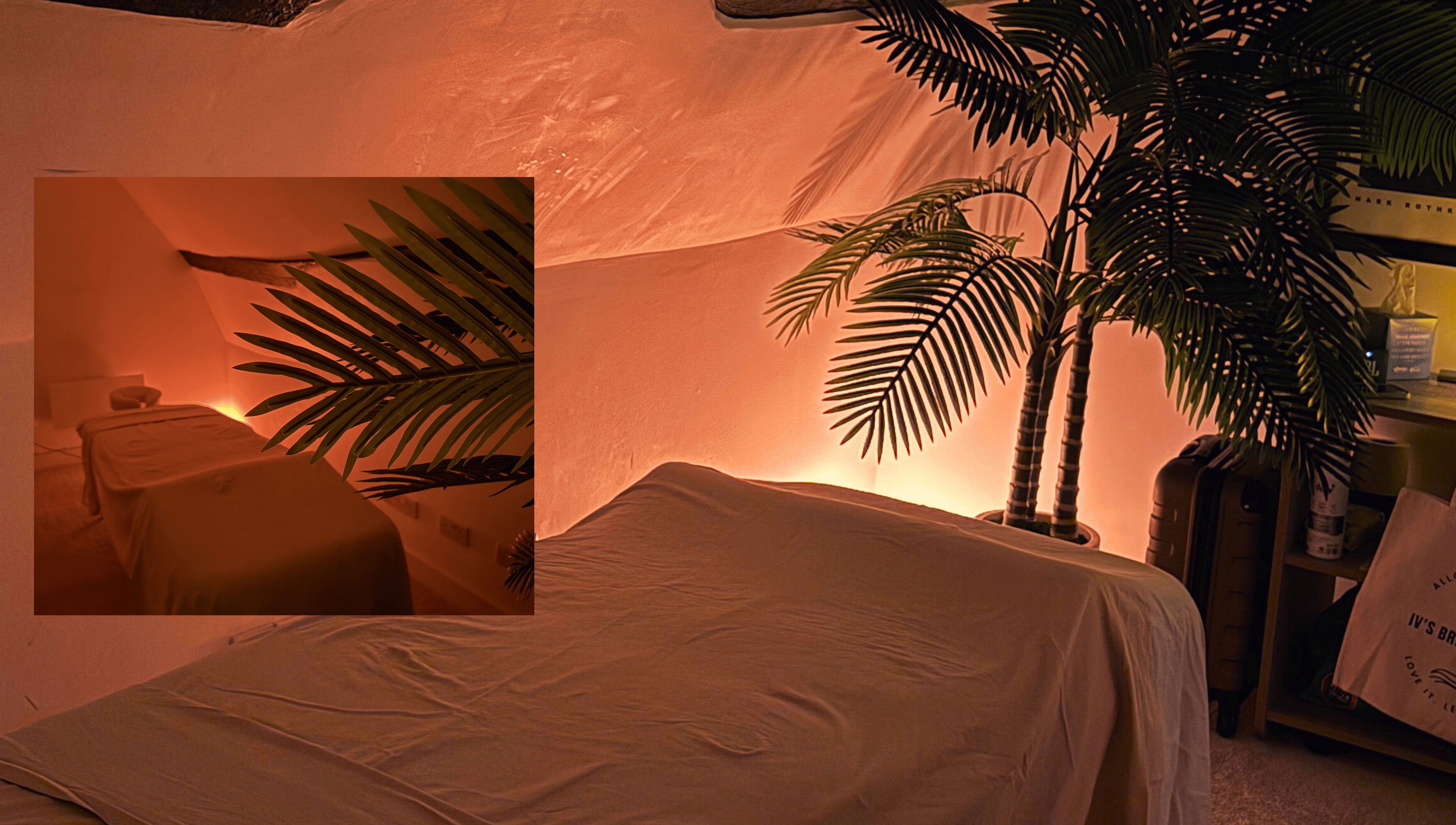 Tranquil massage room at Iv's Breathwork, Totteridge & Whetstone, England, with calming warm lighting.