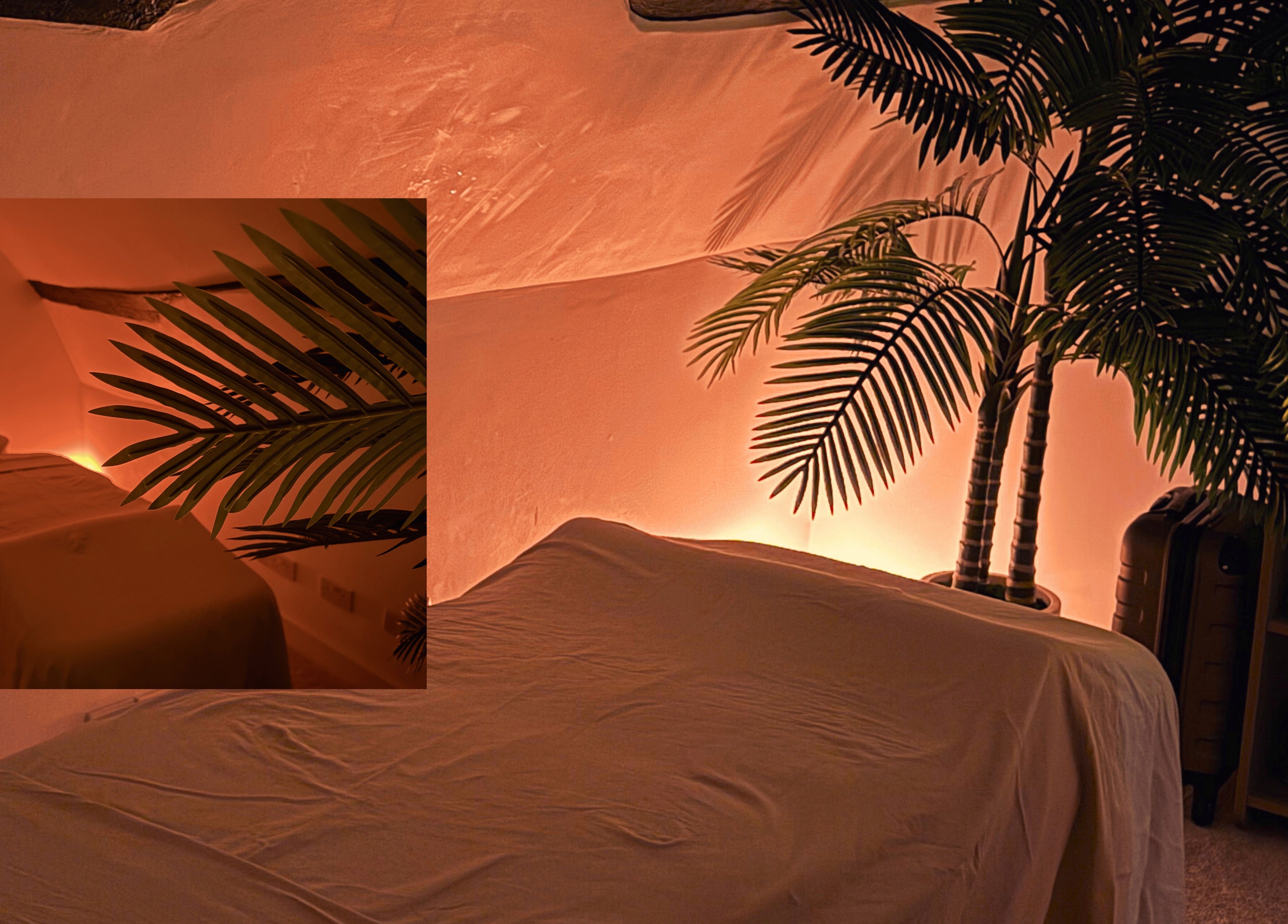 Tranquil massage room at Iv's Breathwork, Totteridge & Whetstone, England, with calming warm lighting.