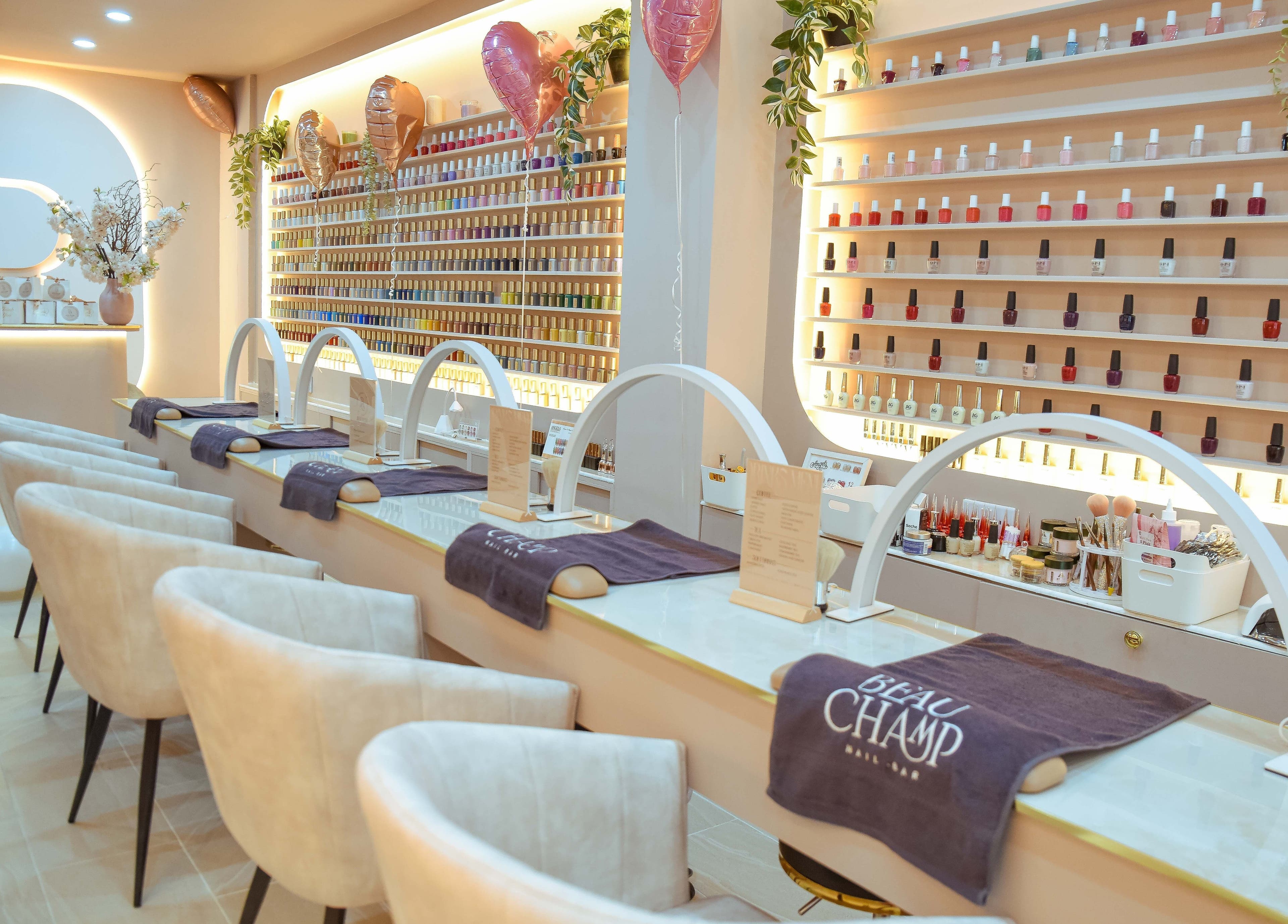 Bright, elegant interior of Beauchamp Nails Bar in London, England, GB with chic nail stations and polished decor.