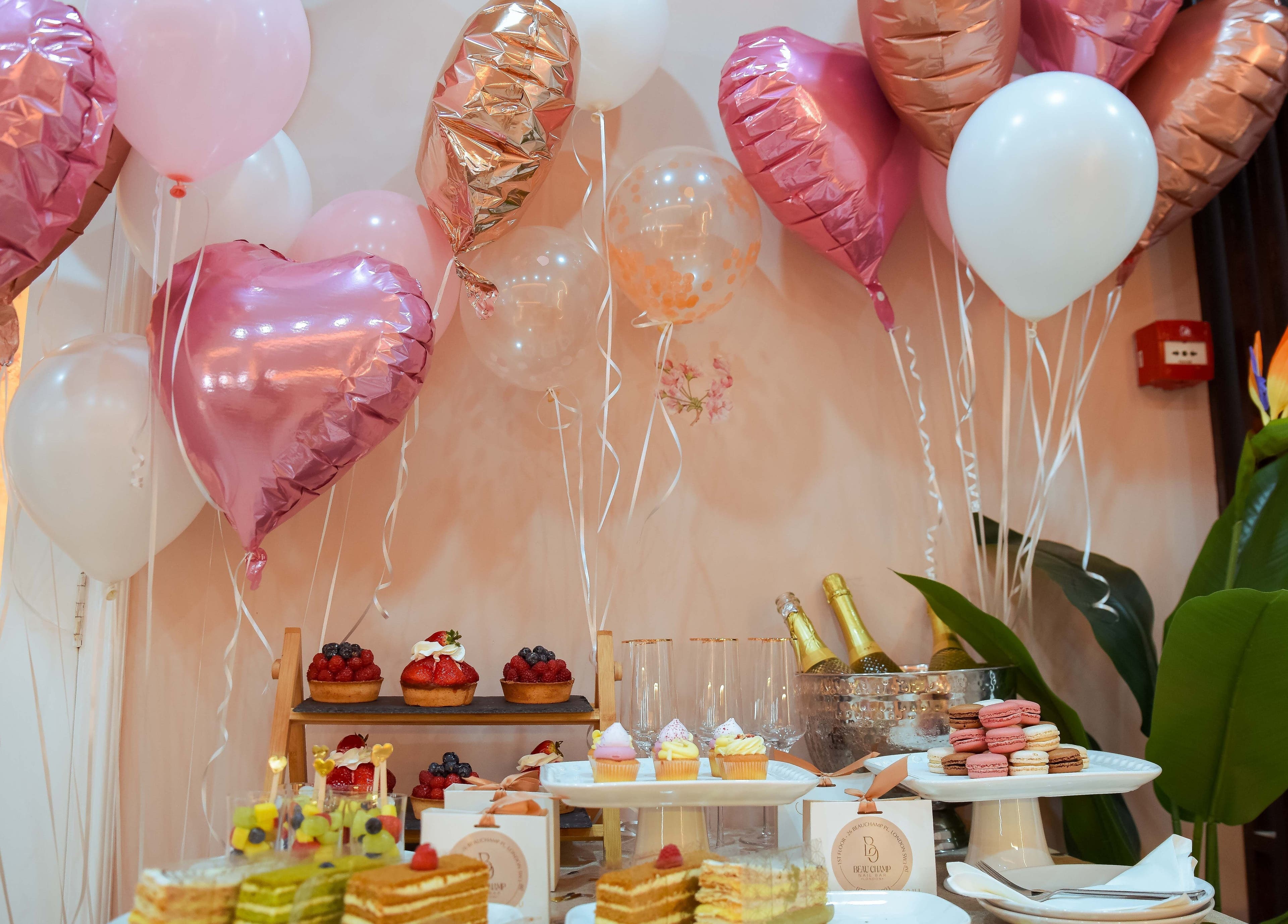 Luxurious party setup with desserts and balloons at Beauchamp Nails Bar, London, England, GB.