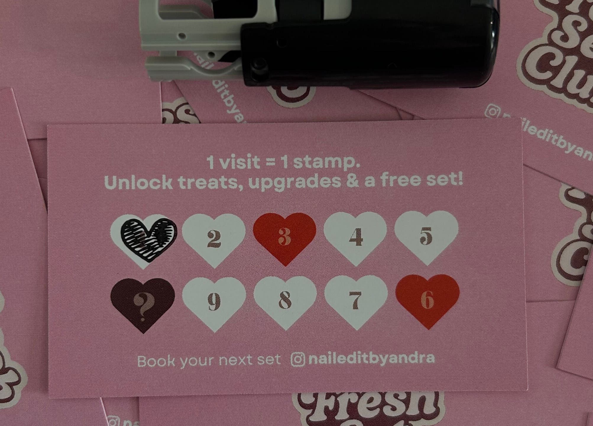 Pink loyalty cards with hearts at Nail Edit by Andra, Carnoustie, Scotland, GB, offering rewards and upgrades.