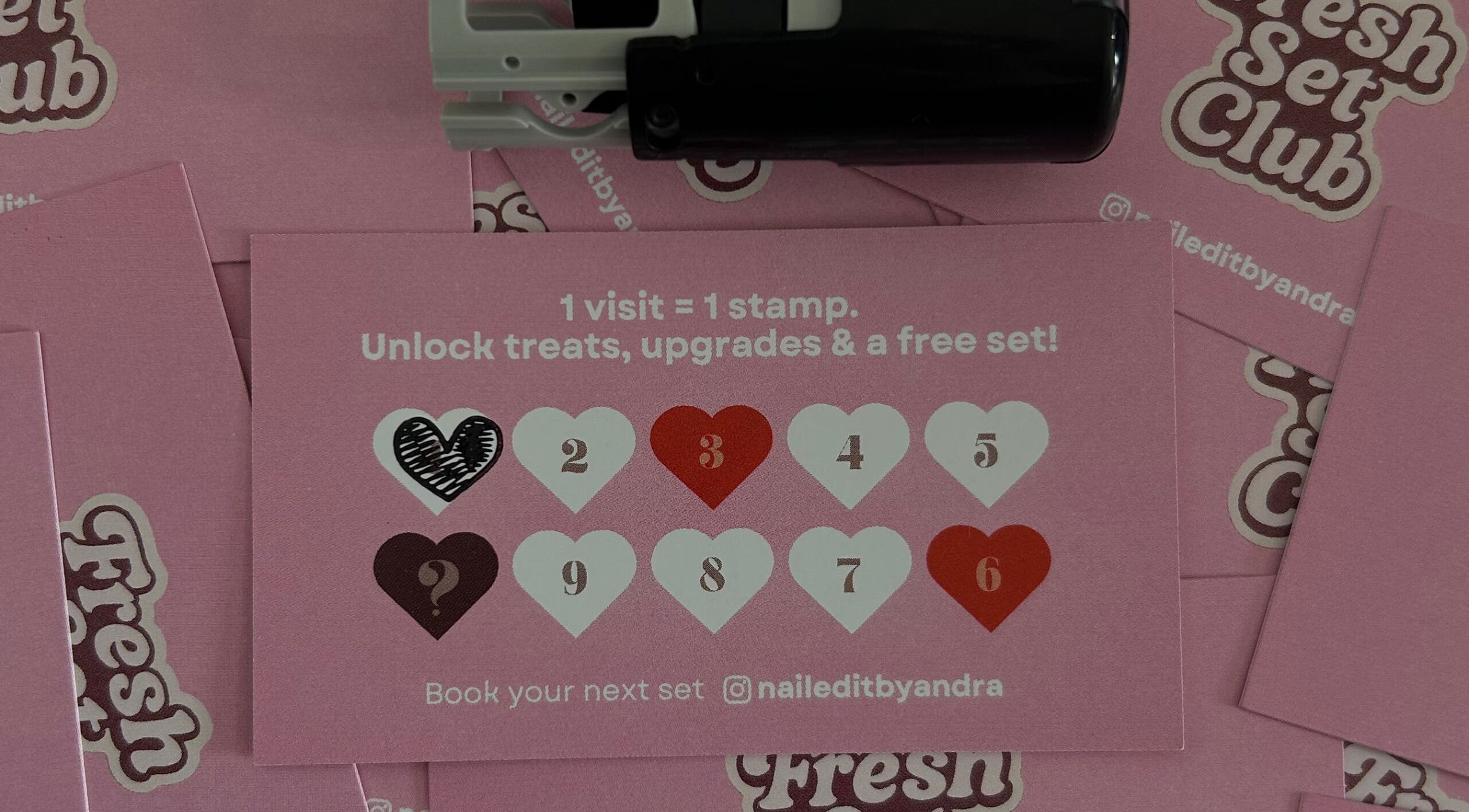 Pink loyalty cards with hearts at Nail Edit by Andra, Carnoustie, Scotland, GB, offering rewards and upgrades.