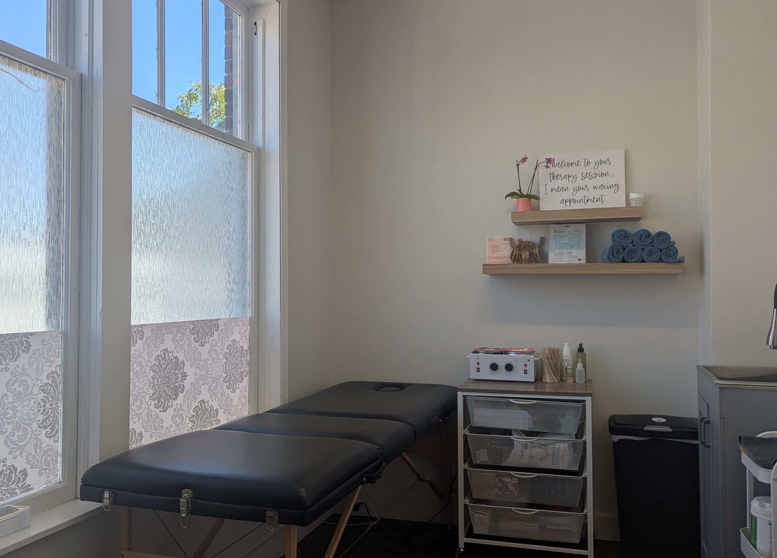 Welcoming wax room at The Backdoor Wax Studio, Trail, British Columbia, CA. Tranquil and well-equipped space.