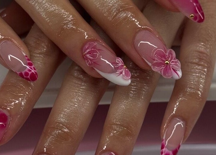 Elegant floral nail art at Sets By Sam, Bell, California, US, showcasing intricate pink designs.