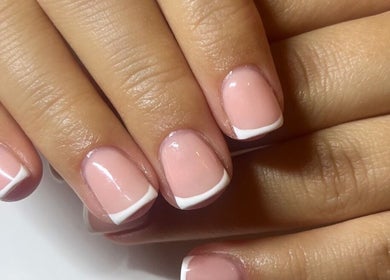 Elegant French manicure at Nailsbymaddymae, Brighton And Hove, England, highlighting delicate craftsmanship.