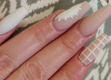 Elegant nail art at Karissa in Grove, Oklahoma, US featuring intricate patterns and neutral shades.