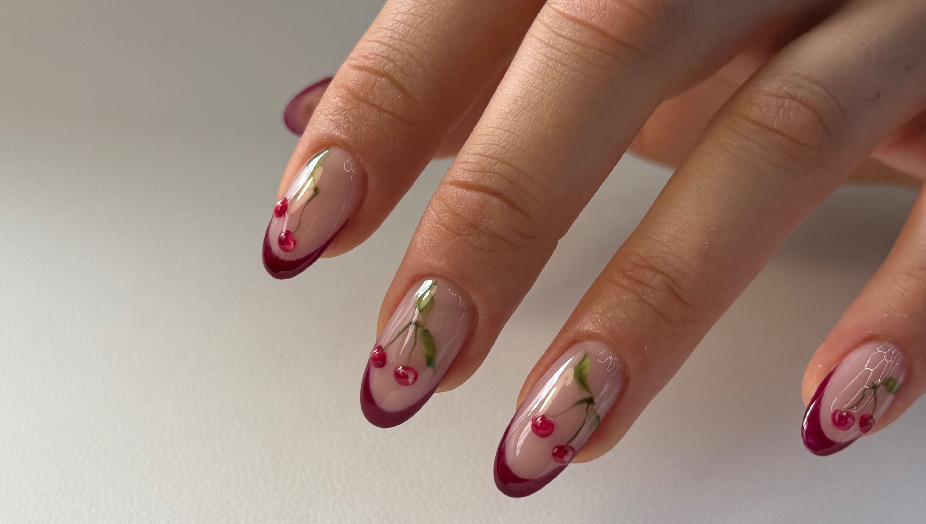 Elegant cherry nail art at For.U From.U in Radstock, England, GB, showcasing intricate design detail.