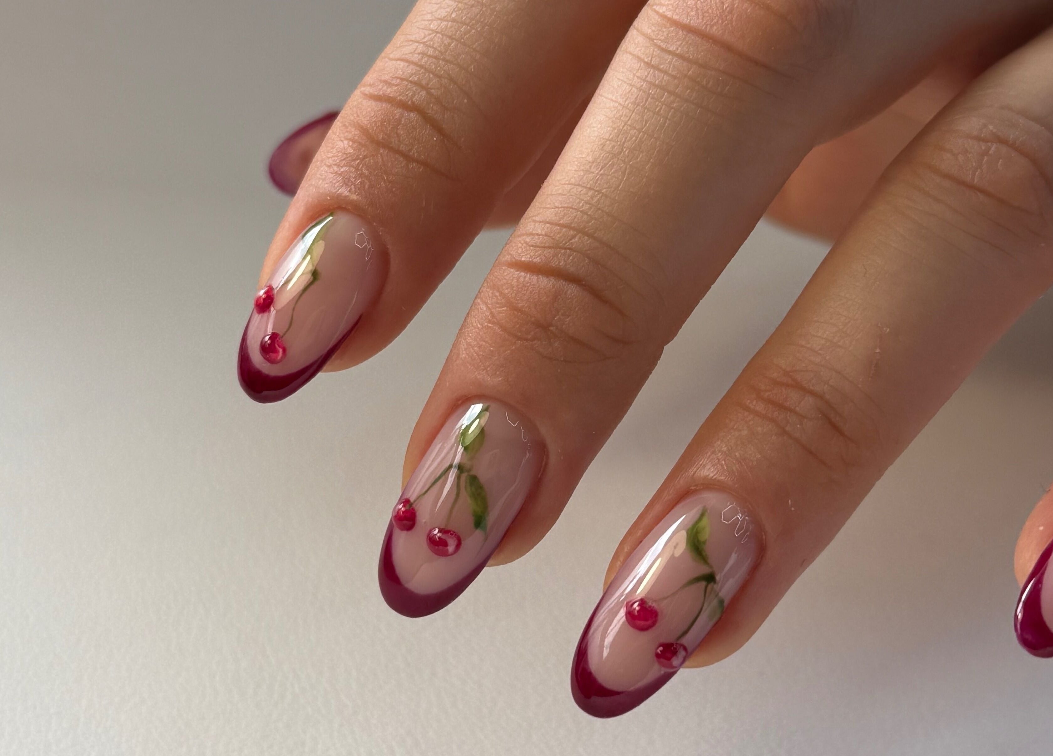 Elegant cherry nail art at For.U From.U in Radstock, England, GB, showcasing intricate design detail.