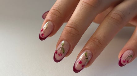 Elegant cherry nail art at For.U From.U in Radstock, England, GB, showcasing intricate design detail.