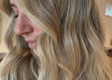 Blonde hair styled in soft waves at Studio Lumee, Everton Park, Queensland, AU.
