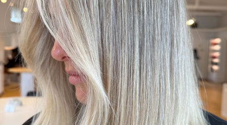 Sleek blonde hair at Studio Lumee in Everton Park, Queensland, AU, showcasing expert styling.