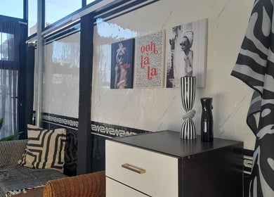 Elegant salon interior at Hair by Me, Cape Town, Western Cape, ZA, showcasing modern decor and stylish furnishings.