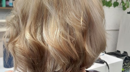 Styled blonde hair at Hair by Me, Cape Town, Western Cape, ZA showcasing expert salon techniques.