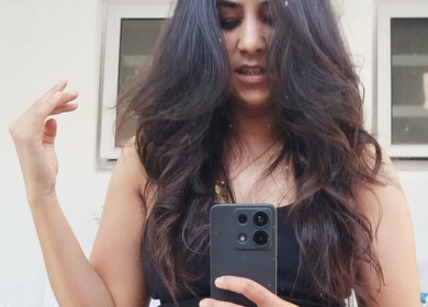 Woman with luscious curls at Hair by Me in Cape Town, Western Cape, ZA, capturing her styled look.