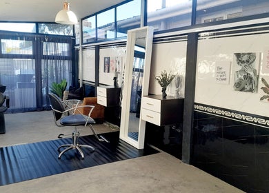 Modern salon interior at Hair by Me, Cape Town, Western Cape, ZA, featuring stylish decor and spacious design.