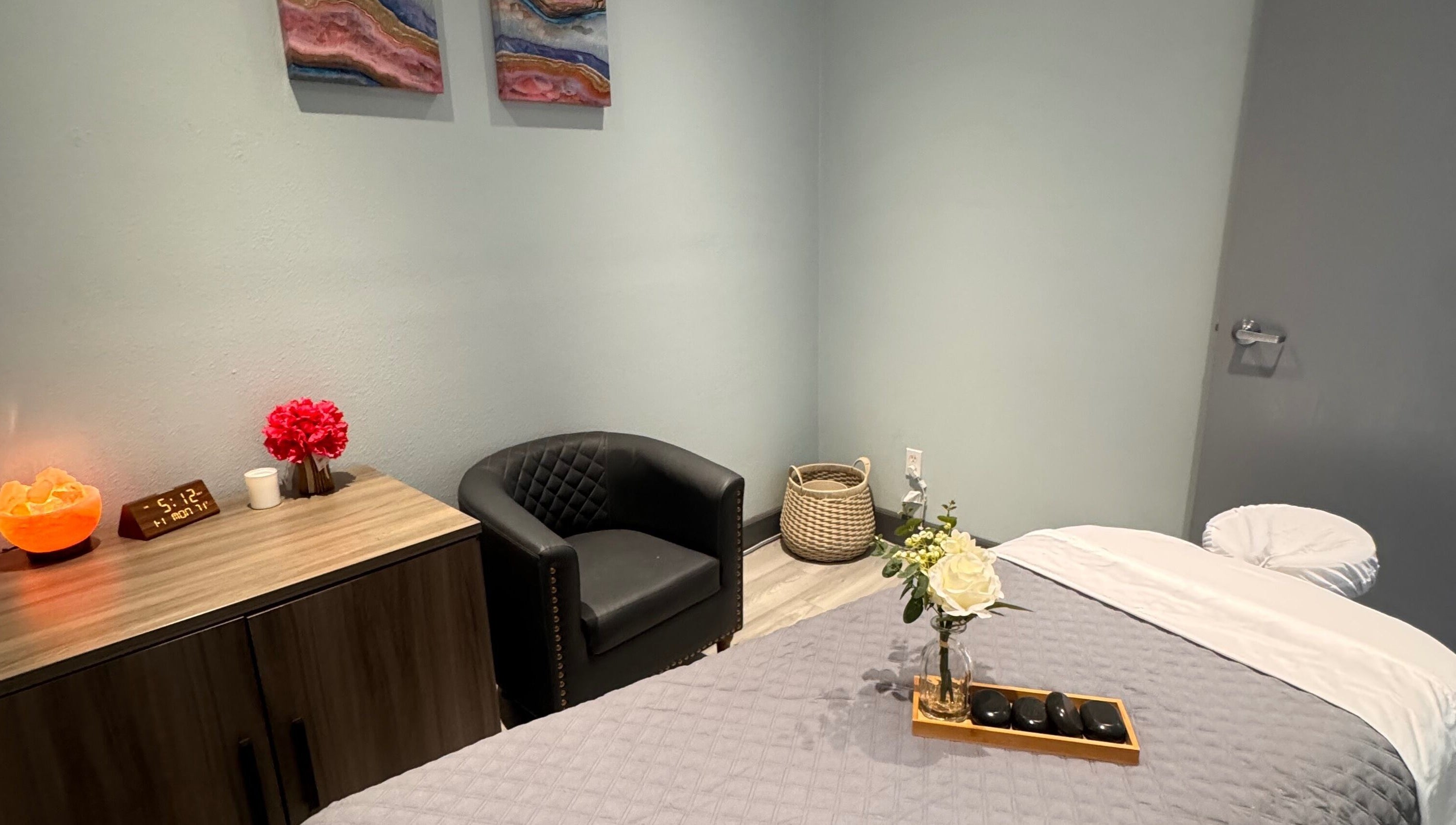 Cozy massage room at Youglow Wellness & Spa, Torrance, California, US, featuring a massage table and elegant decor.
