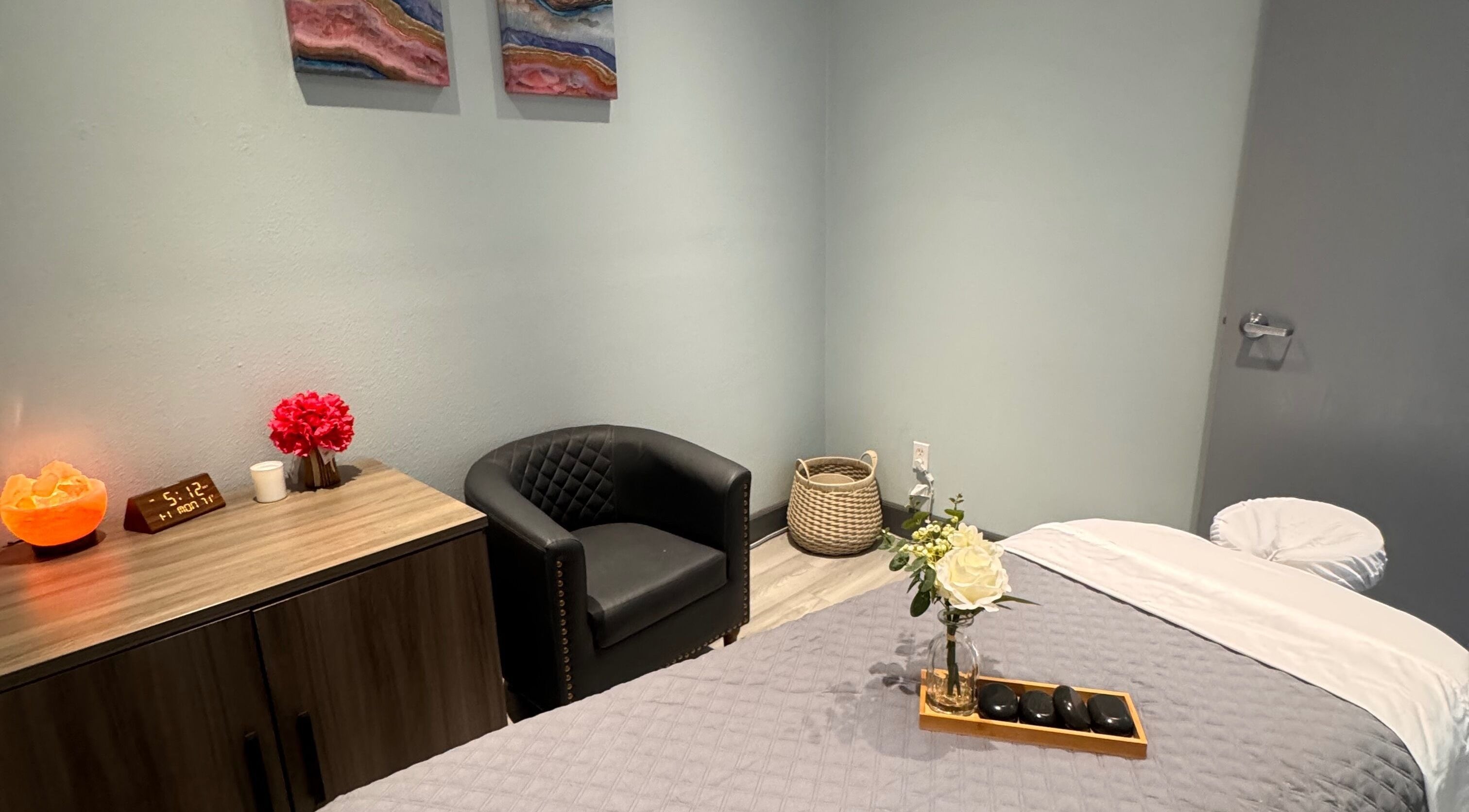 Cozy massage room at Youglow Wellness & Spa, Torrance, California, US, featuring a massage table and elegant decor.