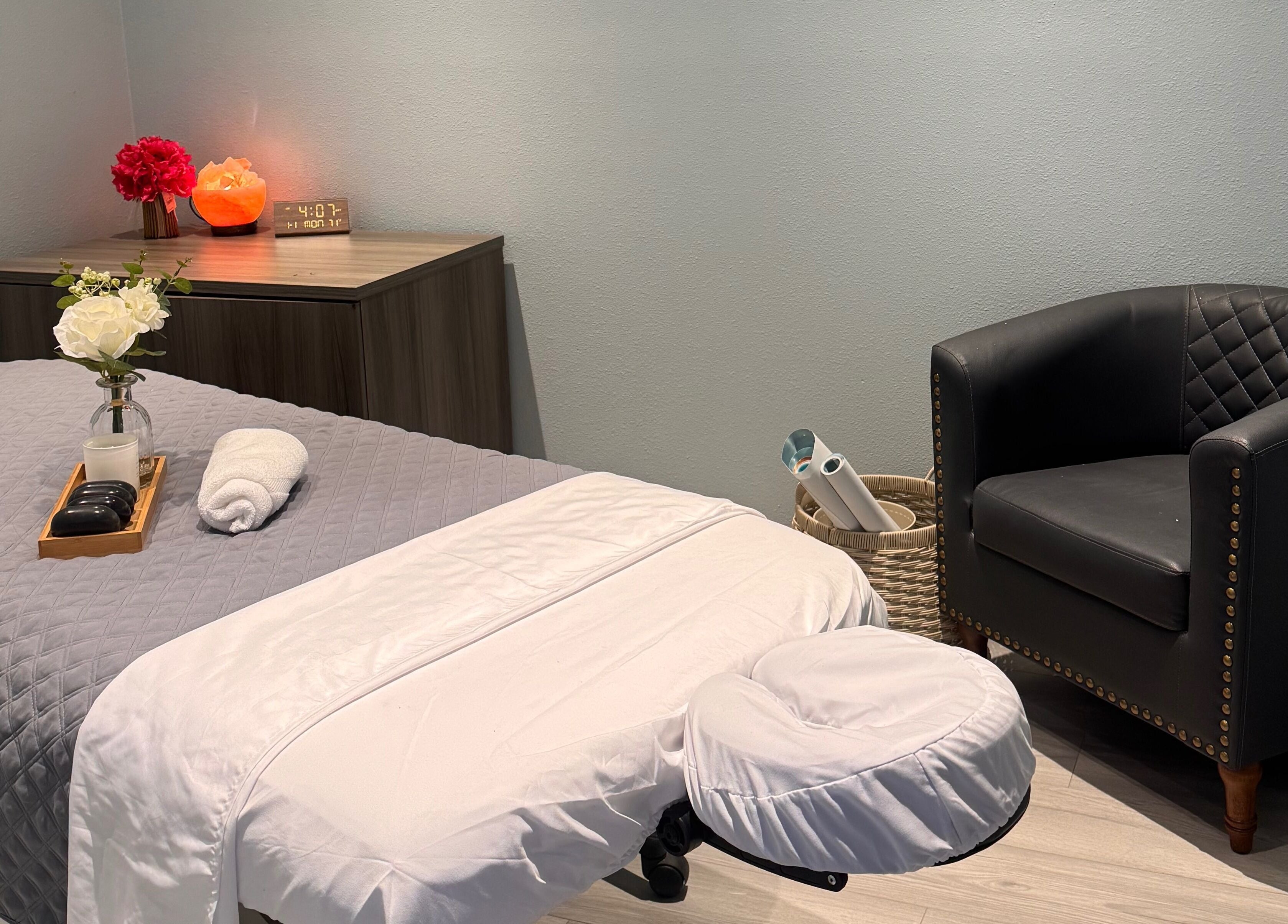 Relaxing massage room at Youglow Wellness & Spa, Torrance, California, US, with a cozy bed and soothing decor.