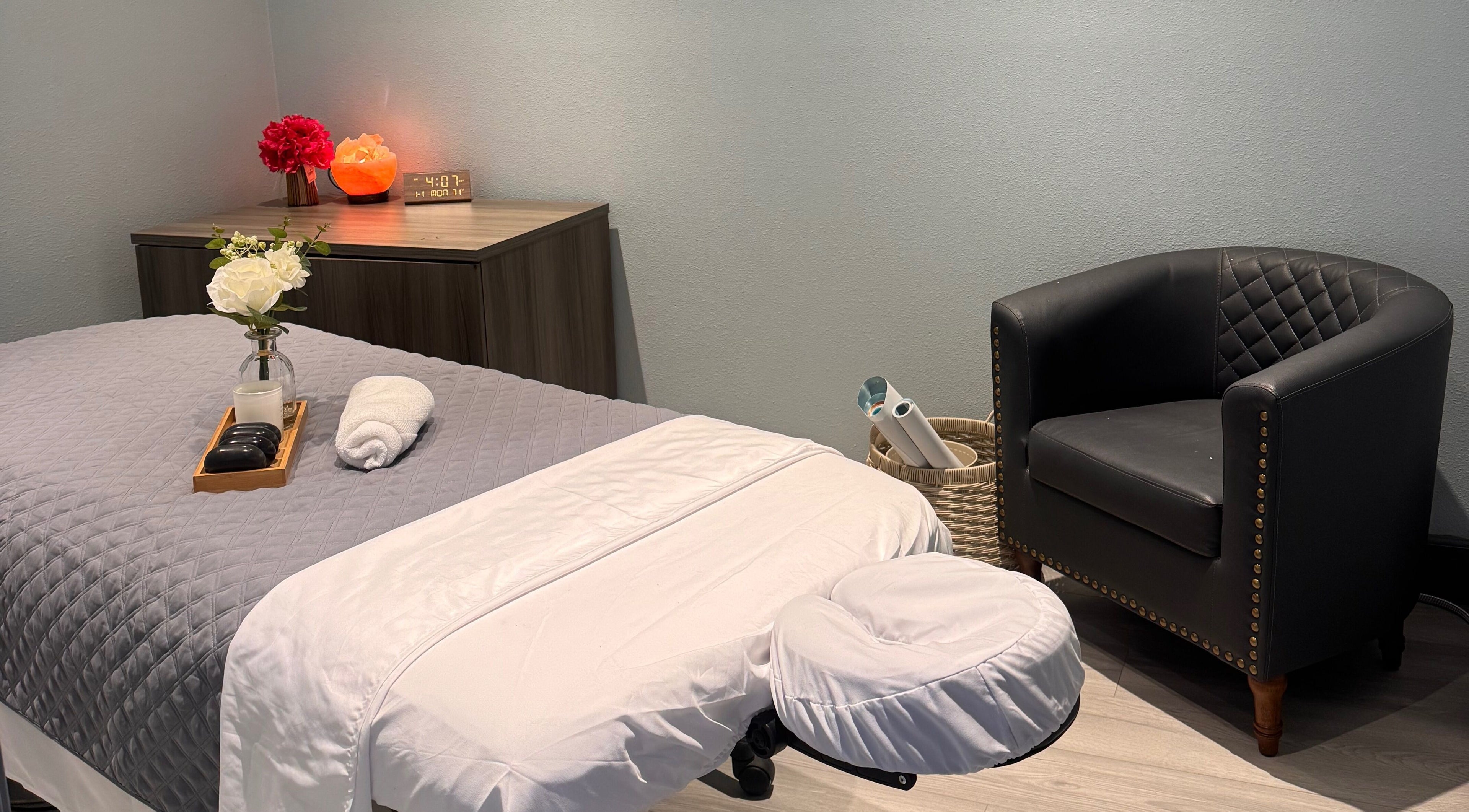 Relaxing massage room at Youglow Wellness & Spa, Torrance, California, US, with a cozy bed and soothing decor.