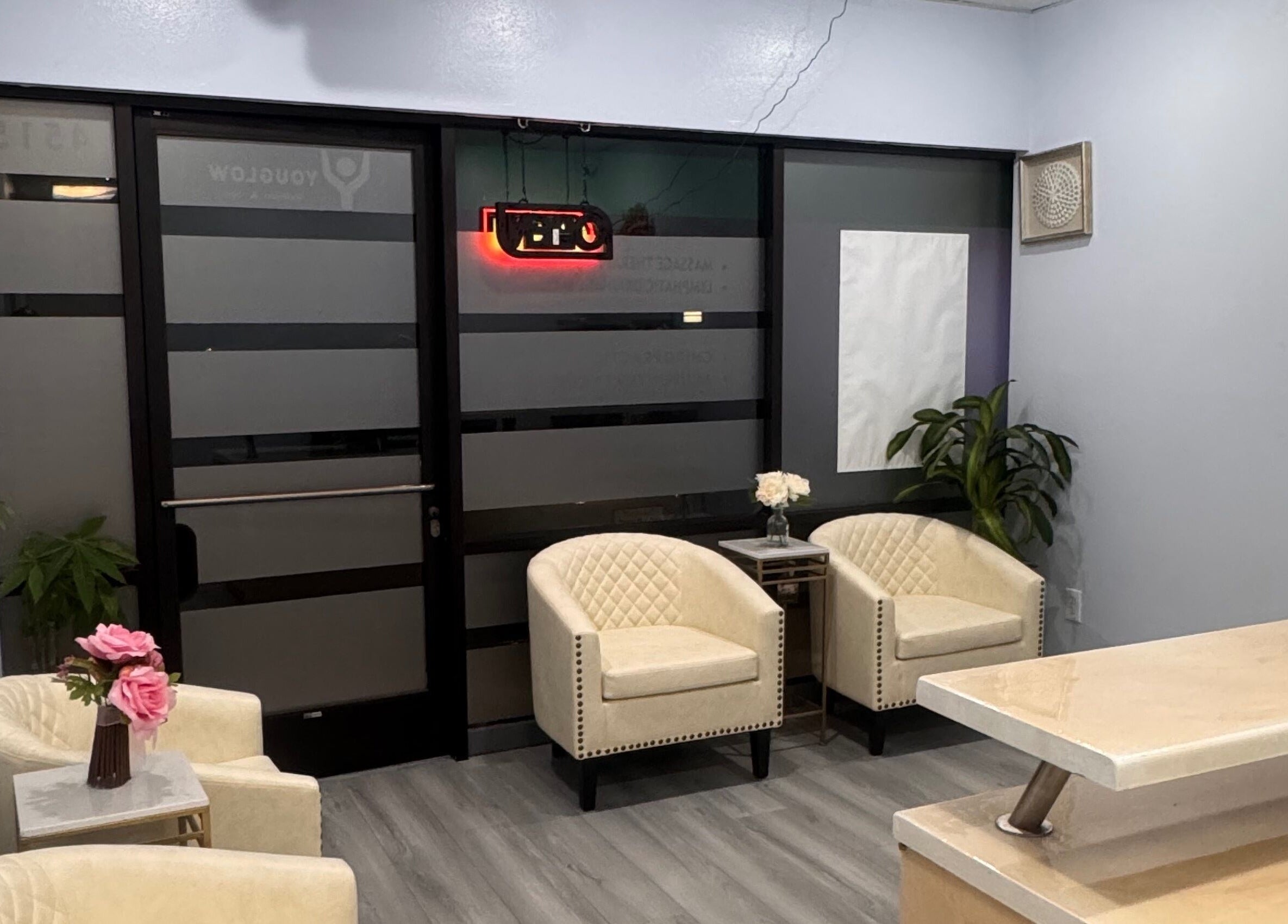 Cozy reception at Youglow Wellness & Spa in Torrance, California, US with plush chairs and calming decor.