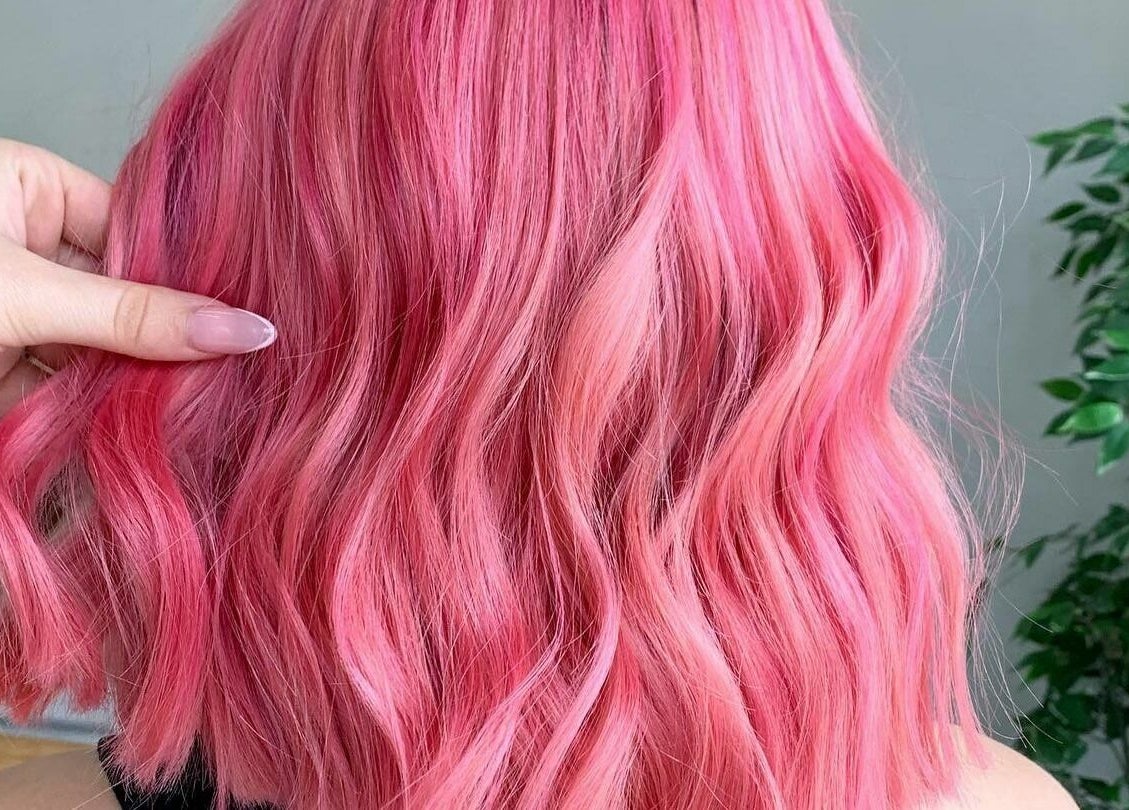 Bright pink wavy hair styled at Rapunzel Rapunzel, North Lakes, Queensland, AU.