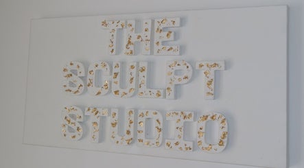 Elegant sign with gold accents of The Sculpt Studio EST 2018 in Sketty, Wales, GB.