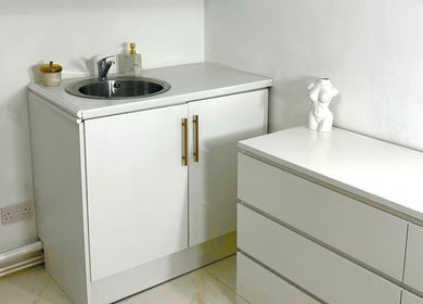 Elegant counter space with sink and minimalist decor at The Sculpt Studio EST 2018, Sketty, Wales, GB.