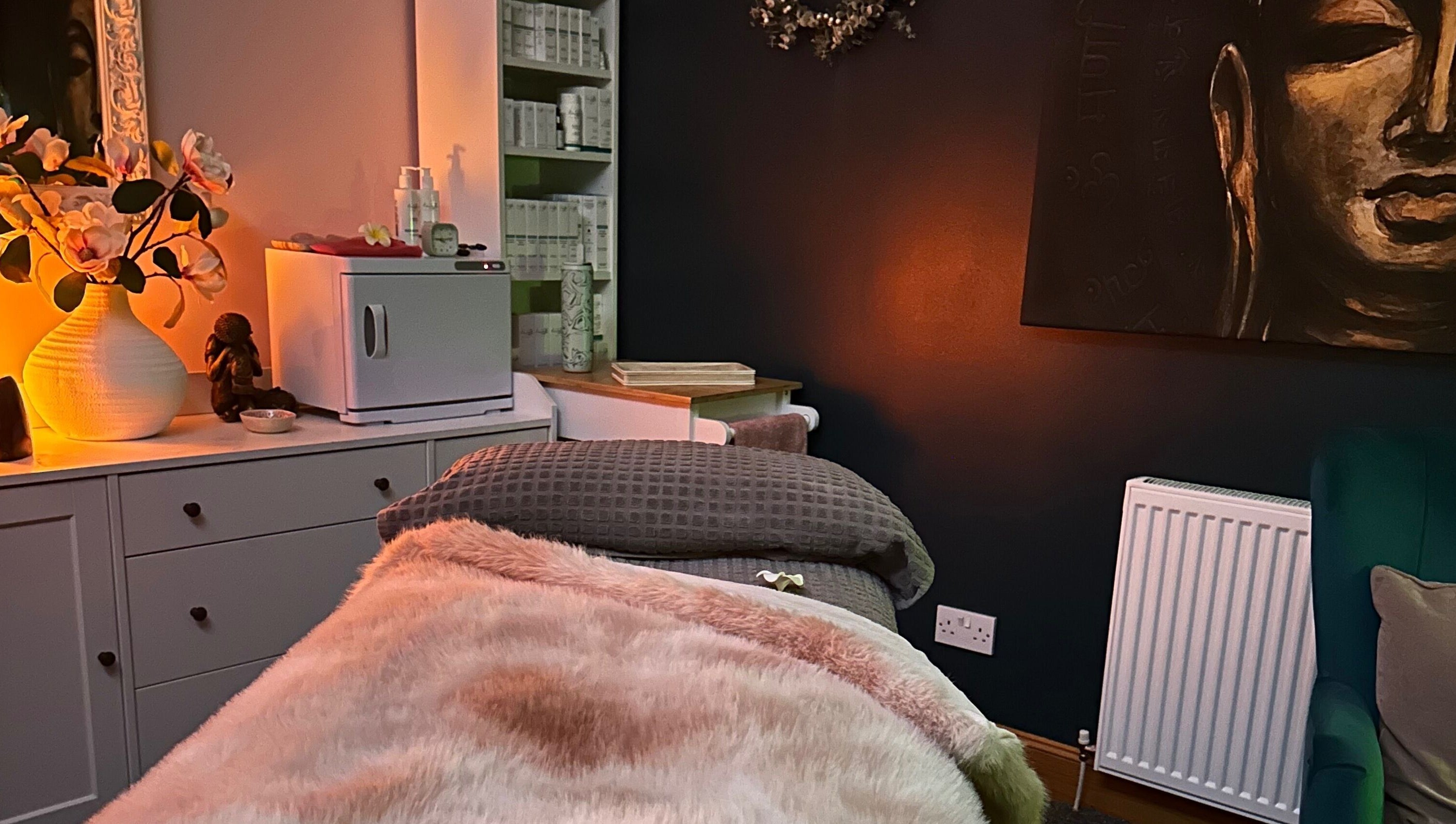 Cozy therapy room at Fiona Dalziel Holistic Therapy in Alloa, Scotland, GB, featuring warm lighting and decor.