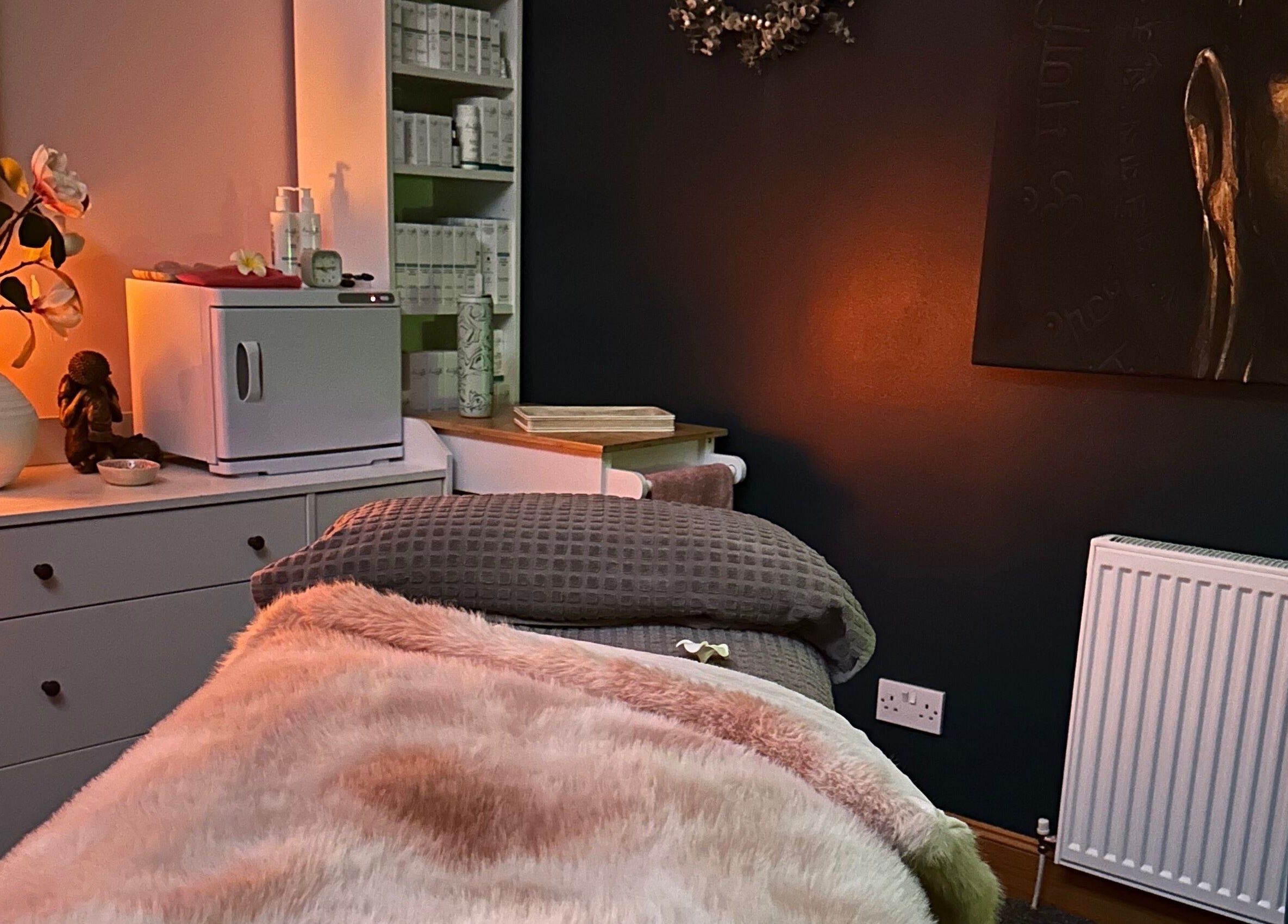 Cozy therapy room at Fiona Dalziel Holistic Therapy in Alloa, Scotland, GB, featuring warm lighting and decor.