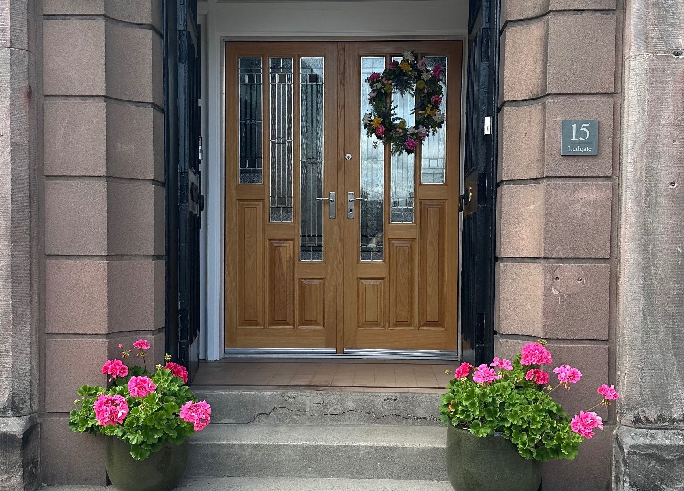 Welcoming front door of Fiona Dalziel Holistic Therapy in Alloa, Scotland, GB with floral decor.